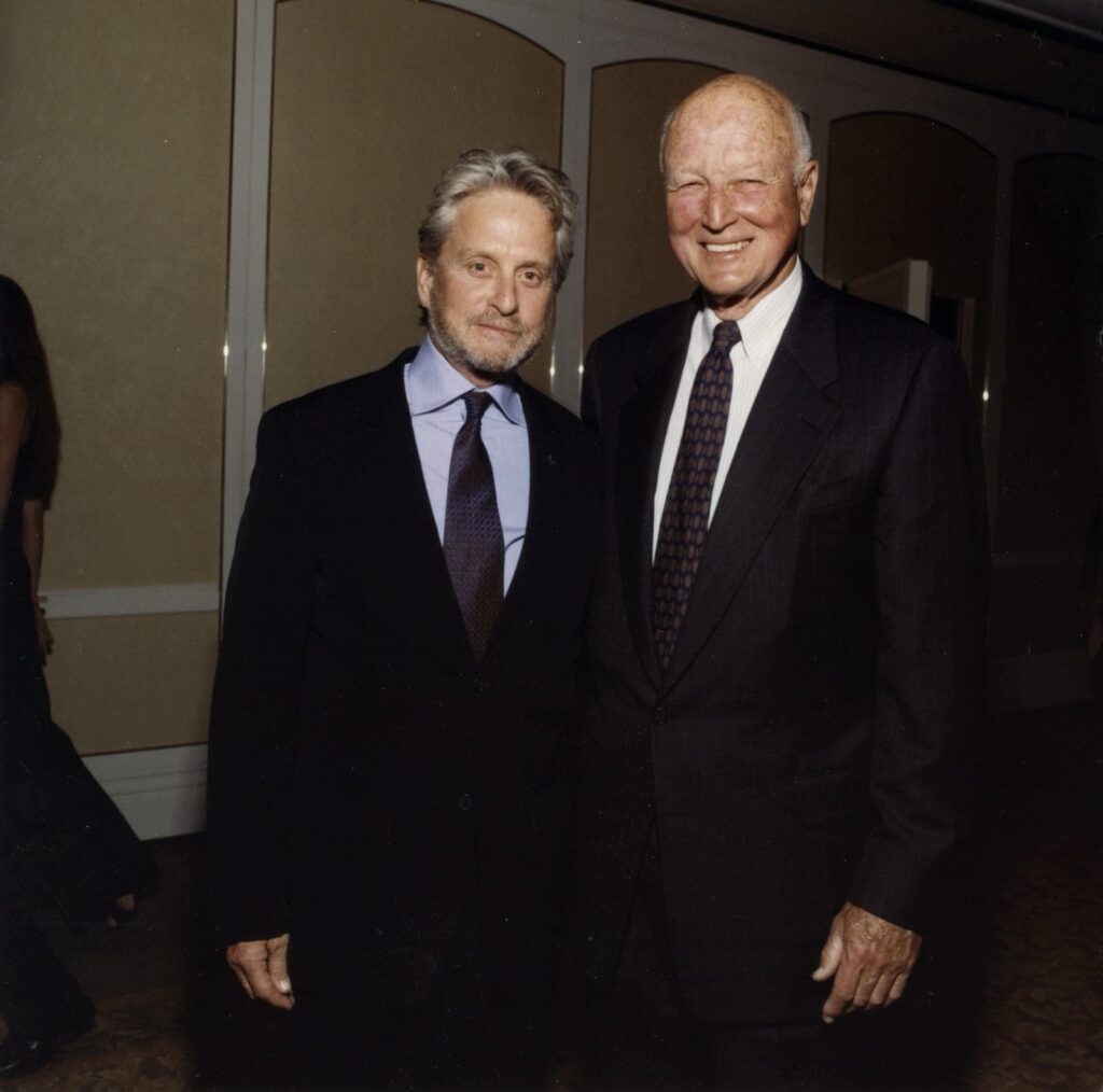 Michael Douglas and Lewis Butler pose together at a Ploughshares event